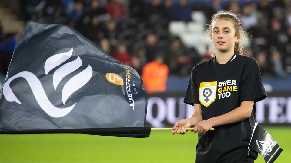 Girl in Her Game Too t-shirt and a Swans flag