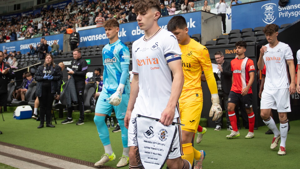 Harlan Perry leads out Swans U17s for PDL final