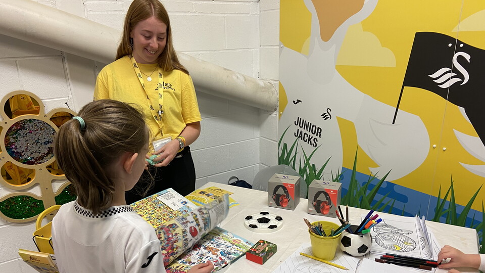Children colouring and using books in the WildSpace sensory zone