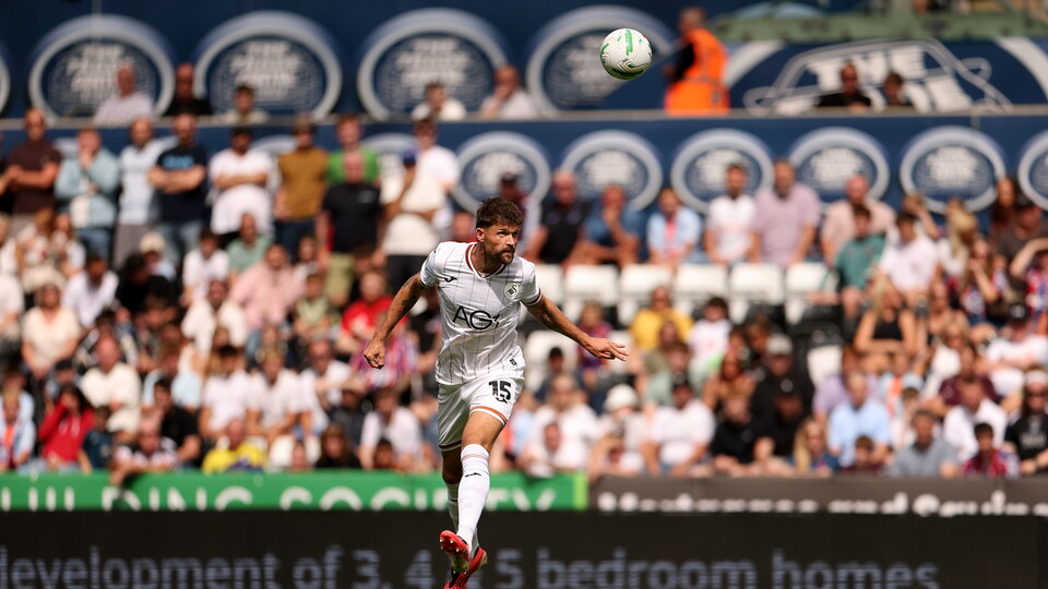 Cameron Burgess clears the ball