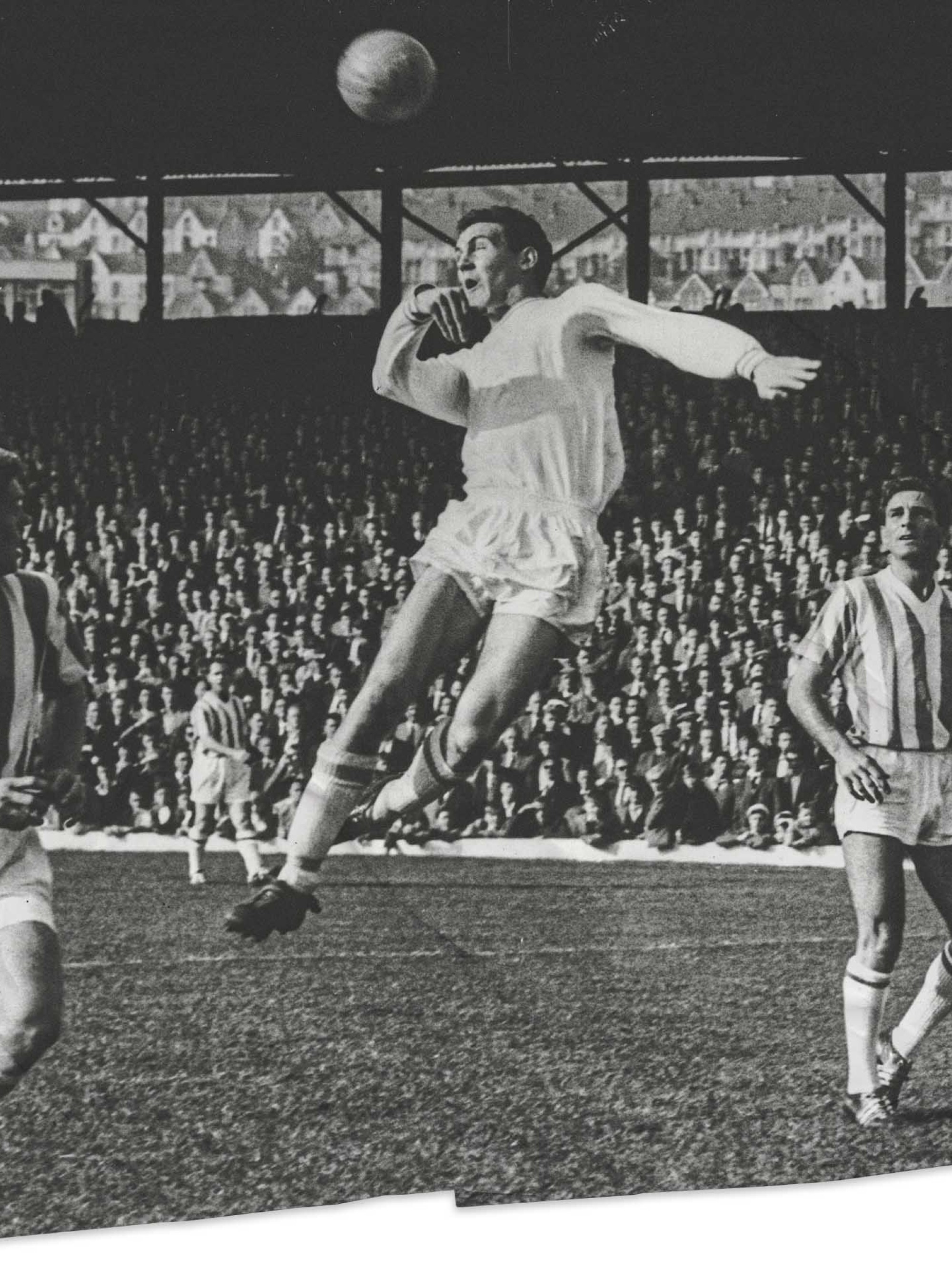 Herbie Williams Heads the ball toward goal