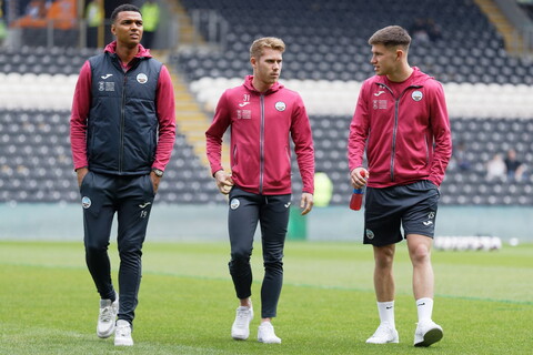 Whittaker, Cooper and Congreve walk on the pitch at the MKM Stadium 