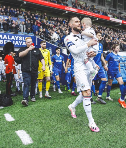 Morgan Ridler as Swansea City Mascot at Cardiff City Stadium, with Matt Grimes