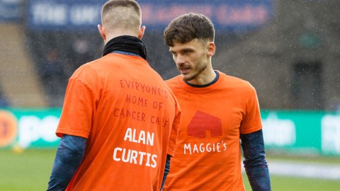 Jamie Paterson and Jerry Yates wear Maggie's warm up shirts